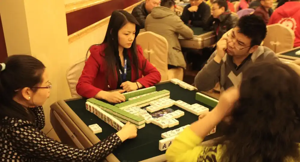 People playing traditional Mahjong
